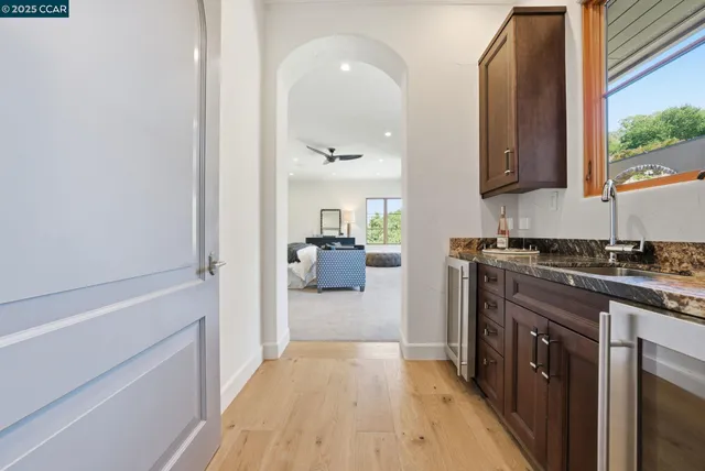 a bedroom with a bed and glass windows