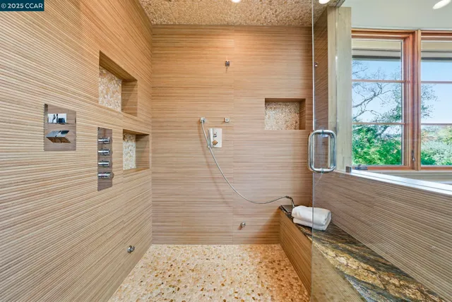 a kitchen with stainless steel appliances kitchen island a stove and a refrigerator