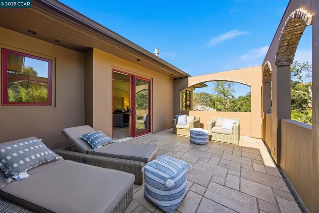 a en suite bathroom with a granite countertop sink and a mirror