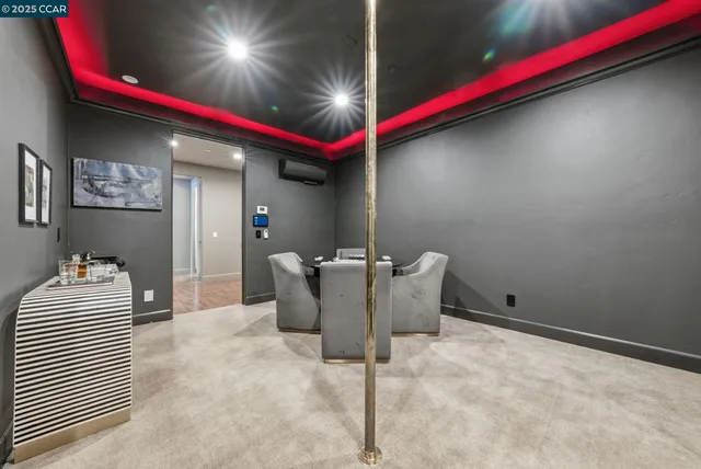 a view of kitchen with stainless steel appliances living room