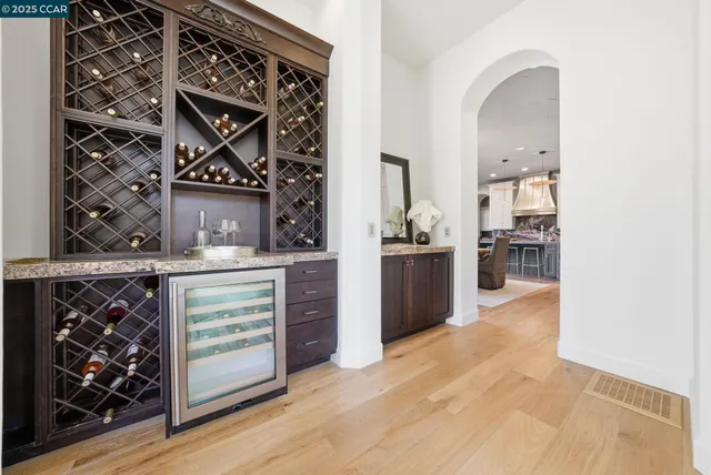 a living room with furniture large window and flat screen tv