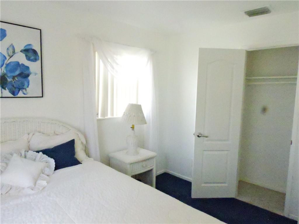3384 Northwest 17th Street Lauderhill, FL 33311 - Photo 11 of 24 a bedroom with a bed and a window