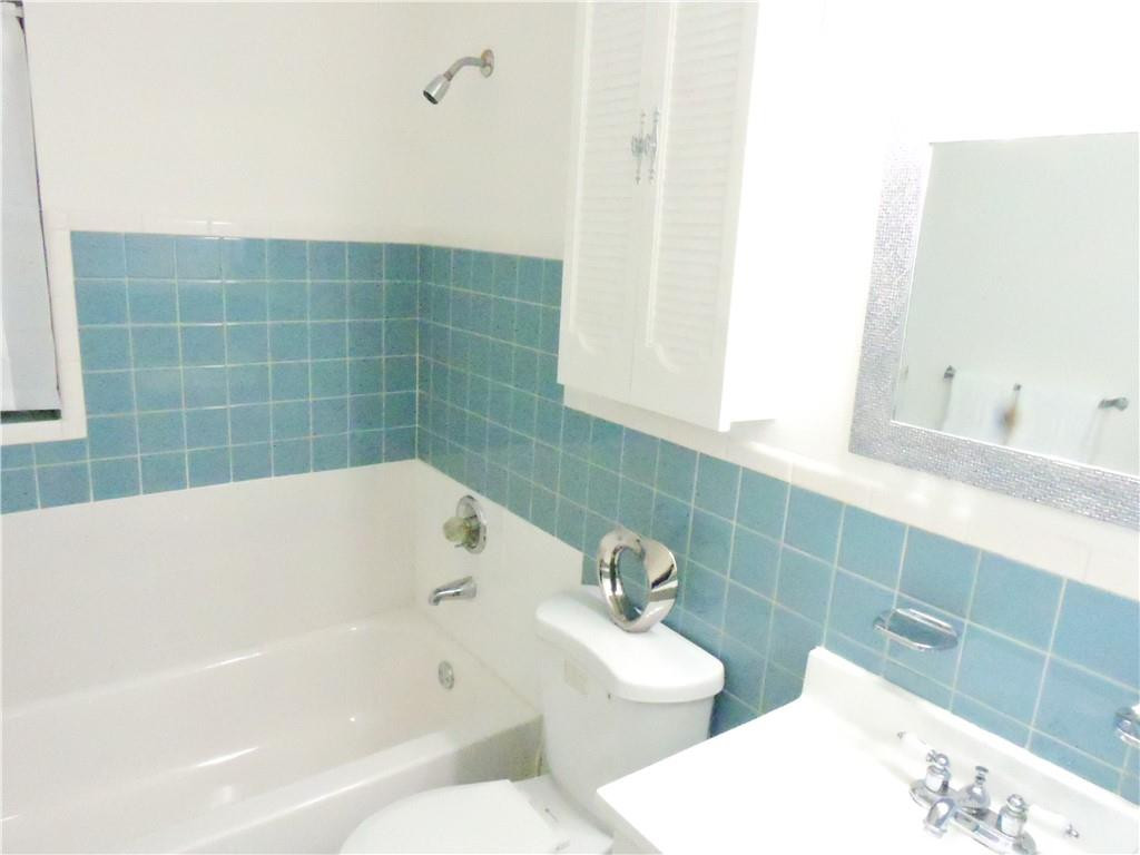 3384 Northwest 17th Street Lauderhill, FL 33311 - Photo 13 of 24 a bathroom with a bathtub and sink