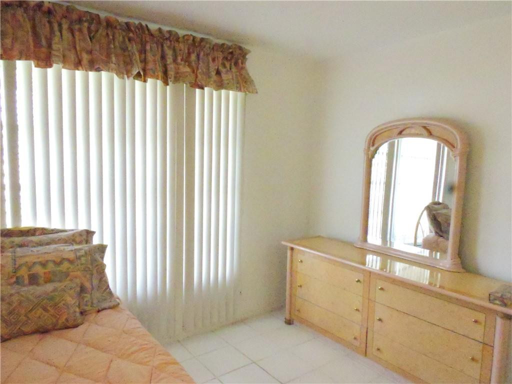 3384 Northwest 17th Street Lauderhill, FL 33311 - Photo 14 of 24 a spacious bathroom with a mirror and a bathtub
