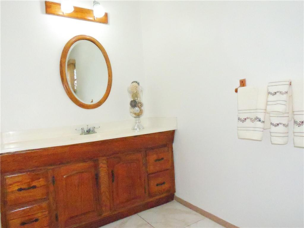 3384 Northwest 17th Street Lauderhill, FL 33311 - Photo 16 of 24 a bathroom with a sink and a mirror