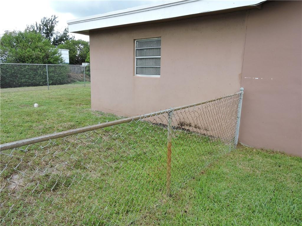 3384 Northwest 17th Street Lauderhill, FL 33311 - Photo 23 of 24 a backyard of a house with lots of green space