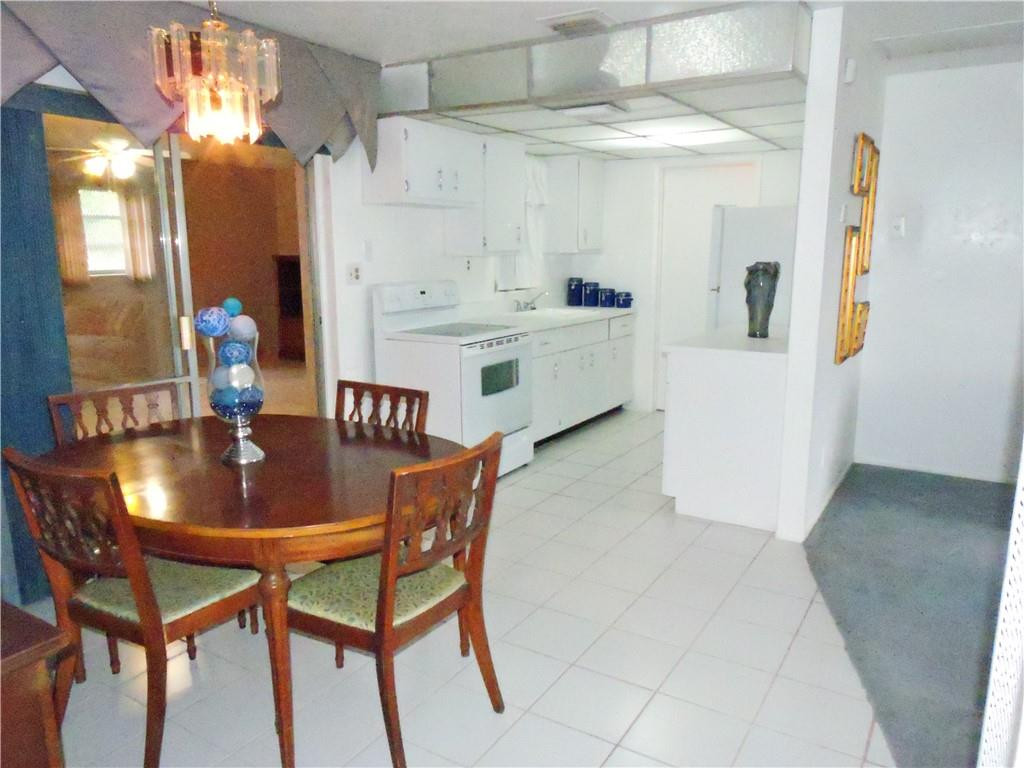 3384 Northwest 17th Street Lauderhill, FL 33311 - Photo 5 of 24 a dining room with furniture and window