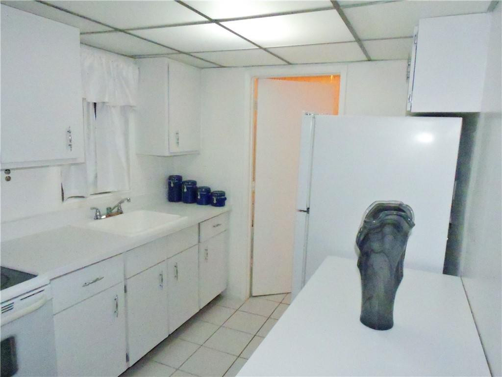 3384 Northwest 17th Street Lauderhill, FL 33311 - Photo 7 of 24 a bathroom with a sink and mirror