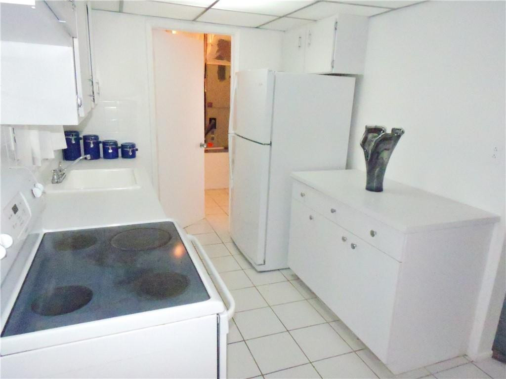 3384 Northwest 17th Street Lauderhill, FL 33311 - Photo 9 of 24 a bathroom with a tub sink and mirror