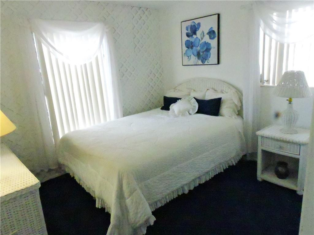 3384 Northwest 17th Street Lauderhill, FL 33311 - Photo 10 of 24 a bedroom with a bed and a window