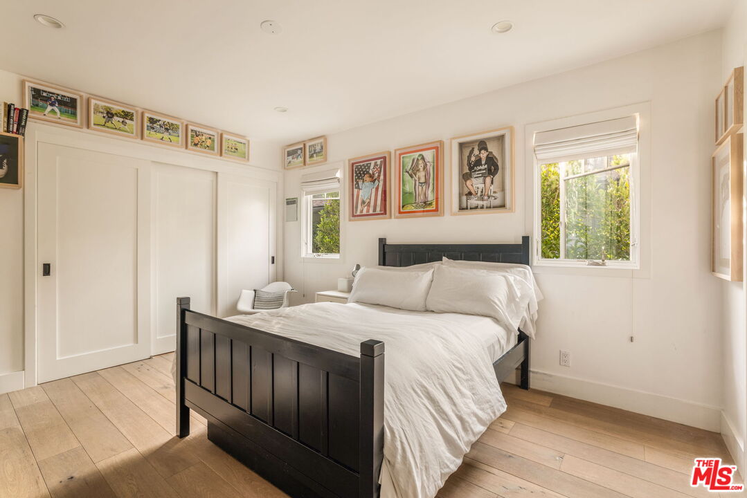 9617 Kirkside Road Los Angeles, CA 90035 - Photo 11 of 14 a bedroom with a bed and a window