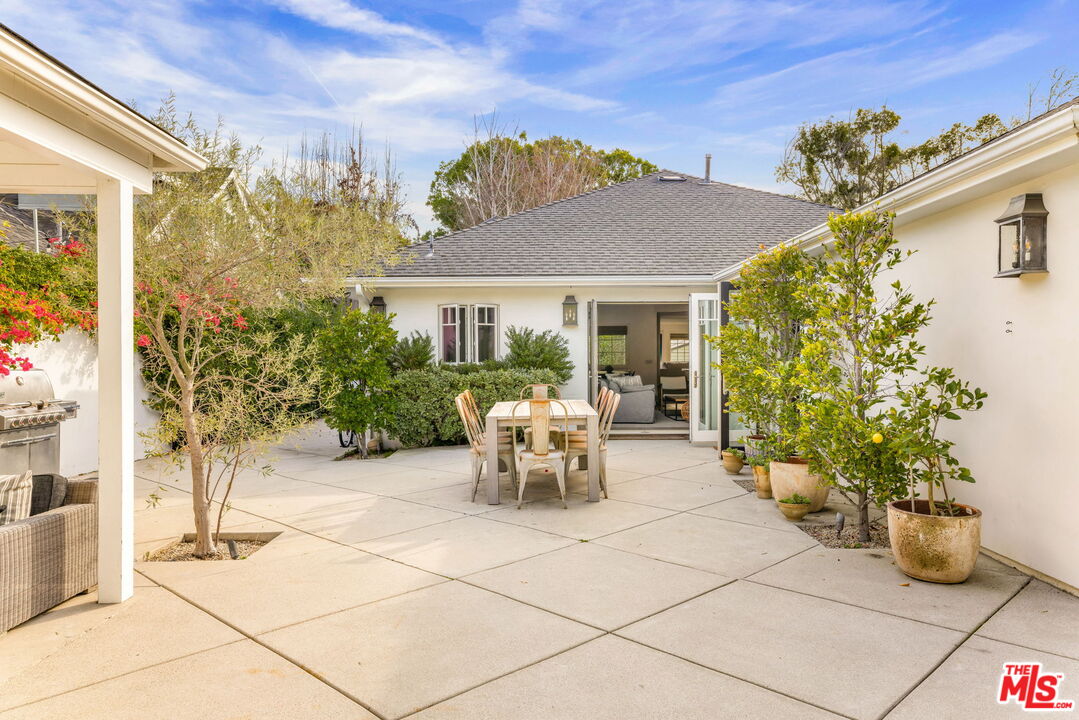 9617 Kirkside Road Los Angeles, CA 90035 - Photo 13 of 14 a view of a patio with table and chairs and potted plants
