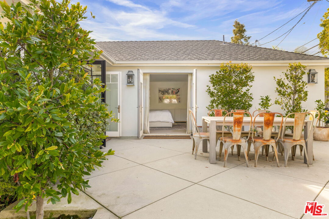 9617 Kirkside Road Los Angeles, CA 90035 - Photo 14 of 14 a view of a patio with table and chairs and potted plants