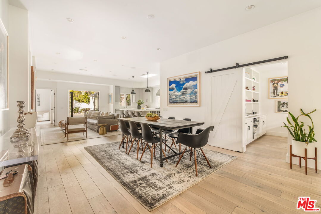 9617 Kirkside Road Los Angeles, CA 90035 - Photo 4 of 14 a view of a dining room with furniture and a rug