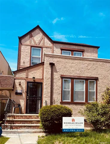 a view of a house with entrance gate