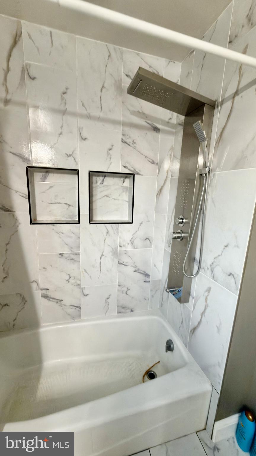 46 Boone Street Cumberland, MD 21502 - Photo 19 of 42 a bathroom with bathtub and shower