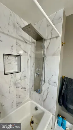 a bathroom with a sink mirror vanity and toilet