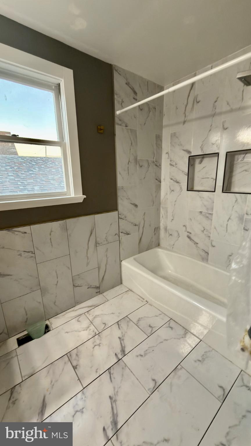 46 Boone Street Cumberland, MD 21502 - Photo 21 of 42 a bathroom with a bathtub and shower