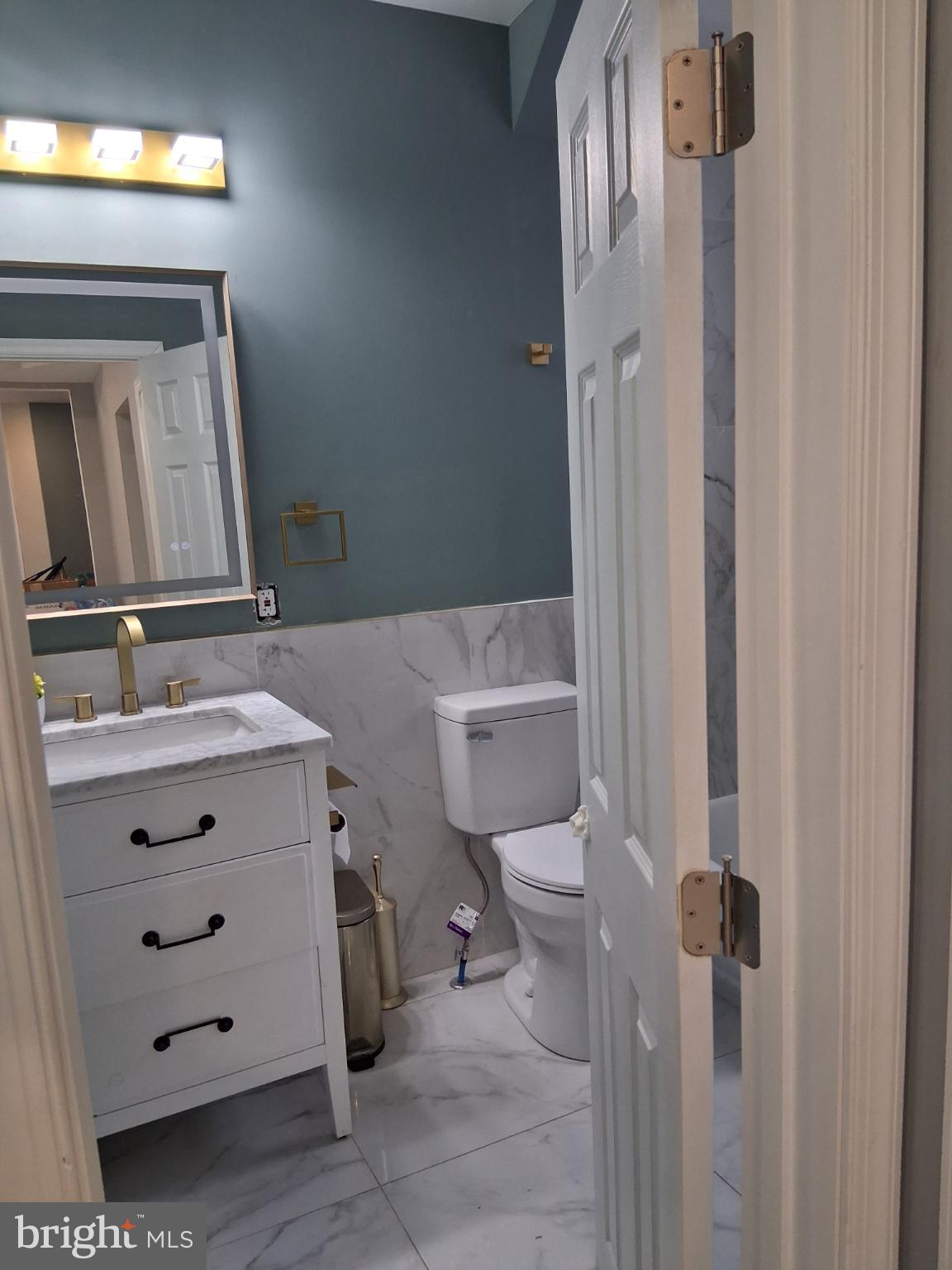 46 Boone Street Cumberland, MD 21502 - Photo 24 of 42 a bathroom with a sink a toilet and shower