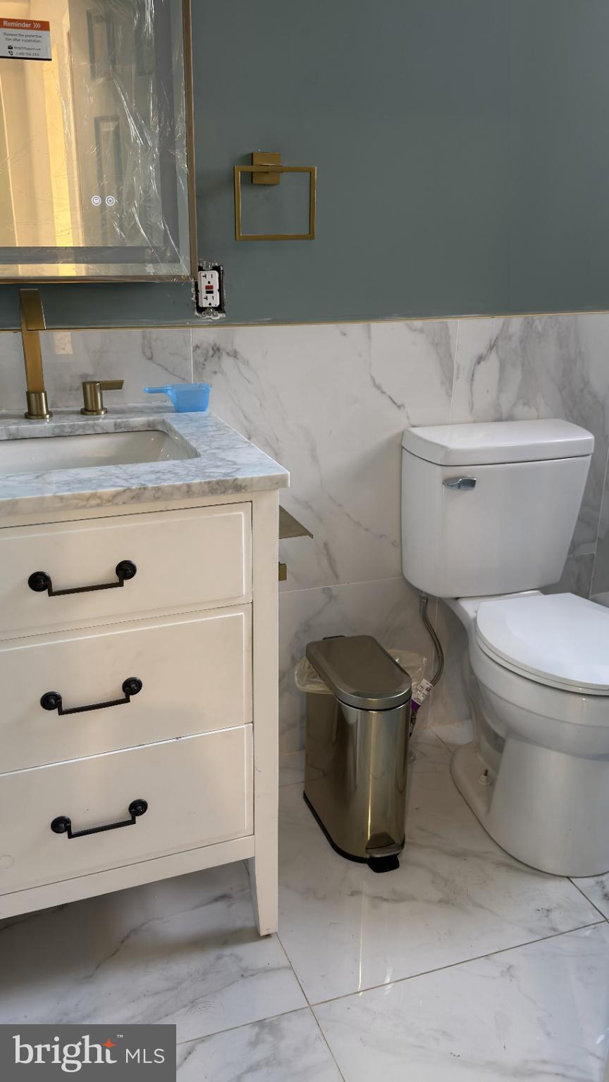 46 Boone Street Cumberland, MD 21502 - Photo 26 of 42 a bathroom with a toilet and a sink