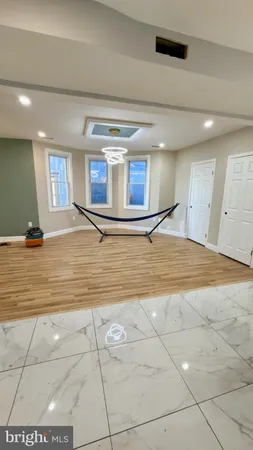 a view of a room with gym equipment and a table