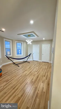 a room with wooden floor and furniture