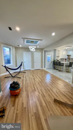 a view of a livingroom with furniture and wooden floor