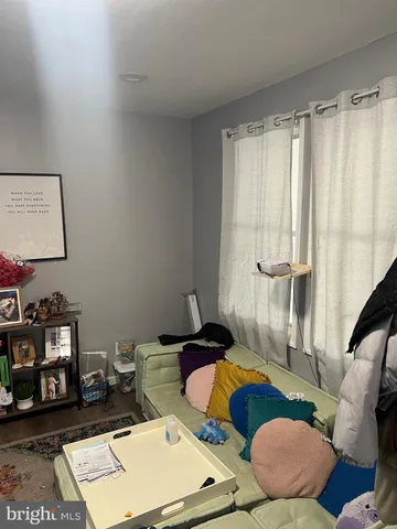 a room with furniture and a flat screen tv