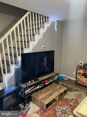 a bedroom with bed and a window