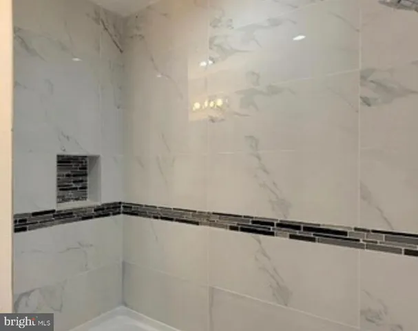 a kitchen with granite countertop a sink and a stove top oven
