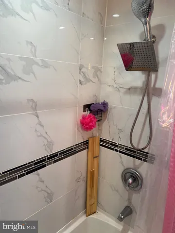 a bathroom with a toilet a sink and a mirror