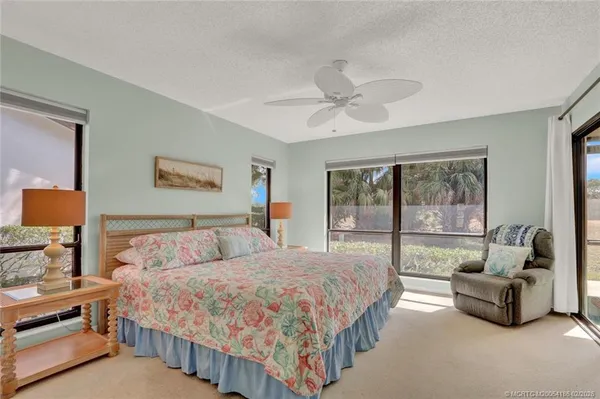 a bedroom with a large bed and a couch