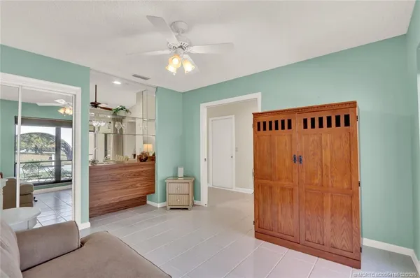 a view of front door and bedroom