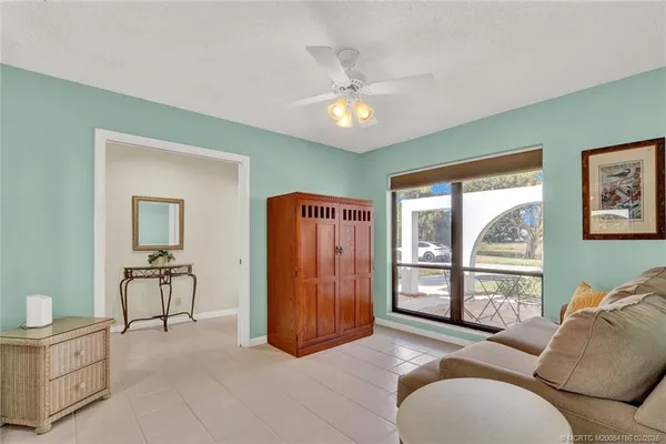 a living room with furniture and a window