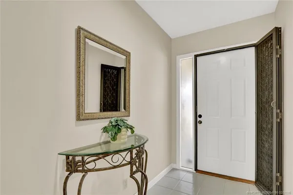 a room that has a mirror and a wooden floor