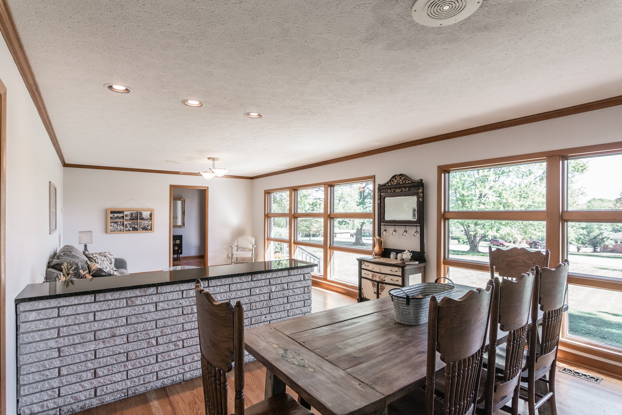 705 Ronnie Road Madison, TN 37115 - Photo 12 of 50 a view of a dining room with furniture large windows and wooden floor