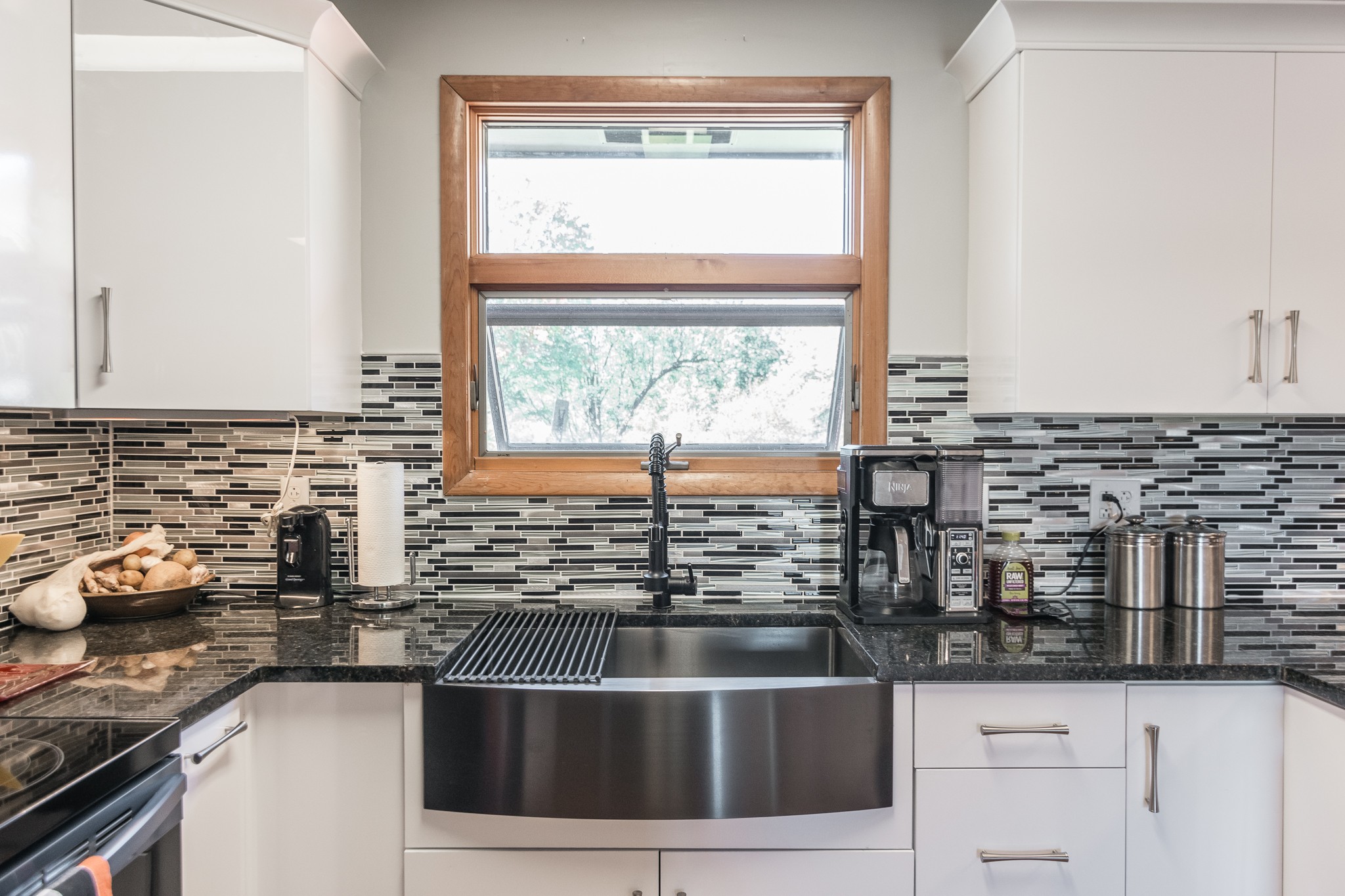 705 Ronnie Road Madison, TN 37115 - Photo 13 of 50 a kitchen with stainless steel appliances kitchen island wooden cabinets and a window