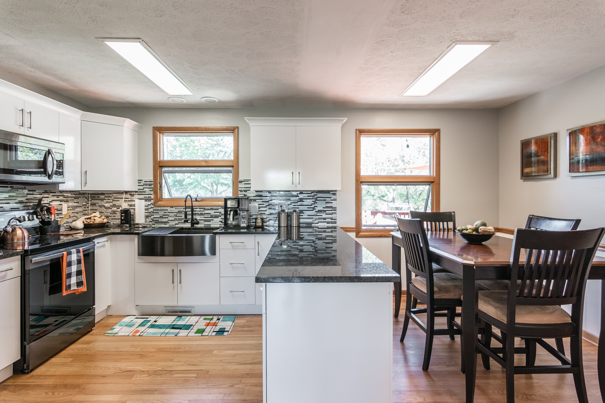 705 Ronnie Road Madison, TN 37115 - Photo 16 of 50 a kitchen with granite countertop a table and chairs