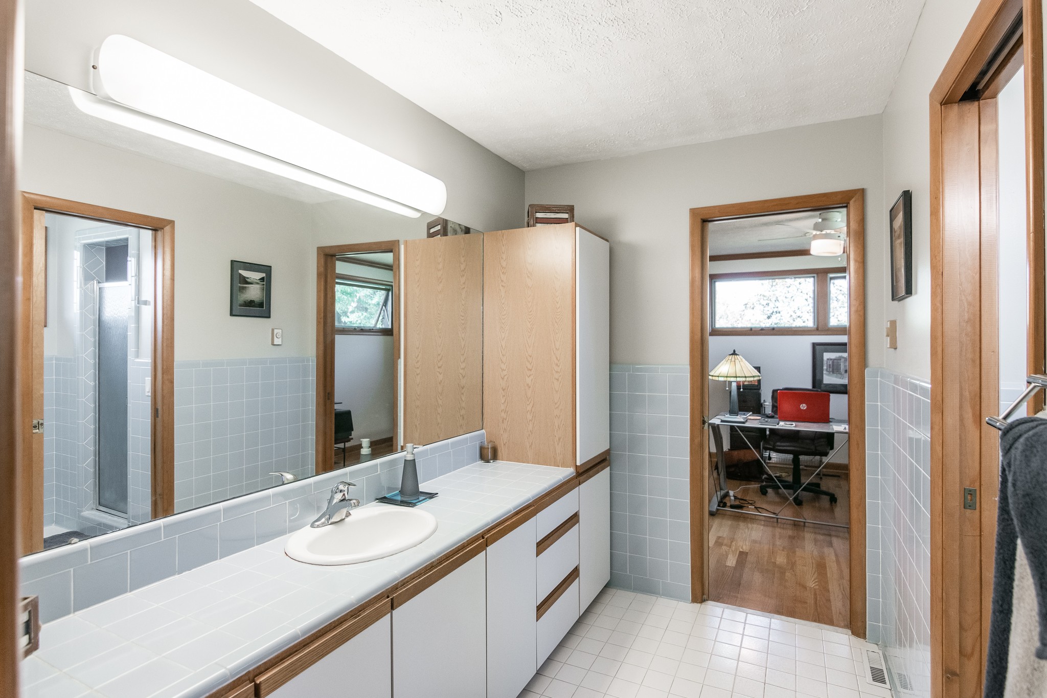 705 Ronnie Road Madison, TN 37115 - Photo 25 of 50 a en suite bathroom with a double vanity sink and a mirror