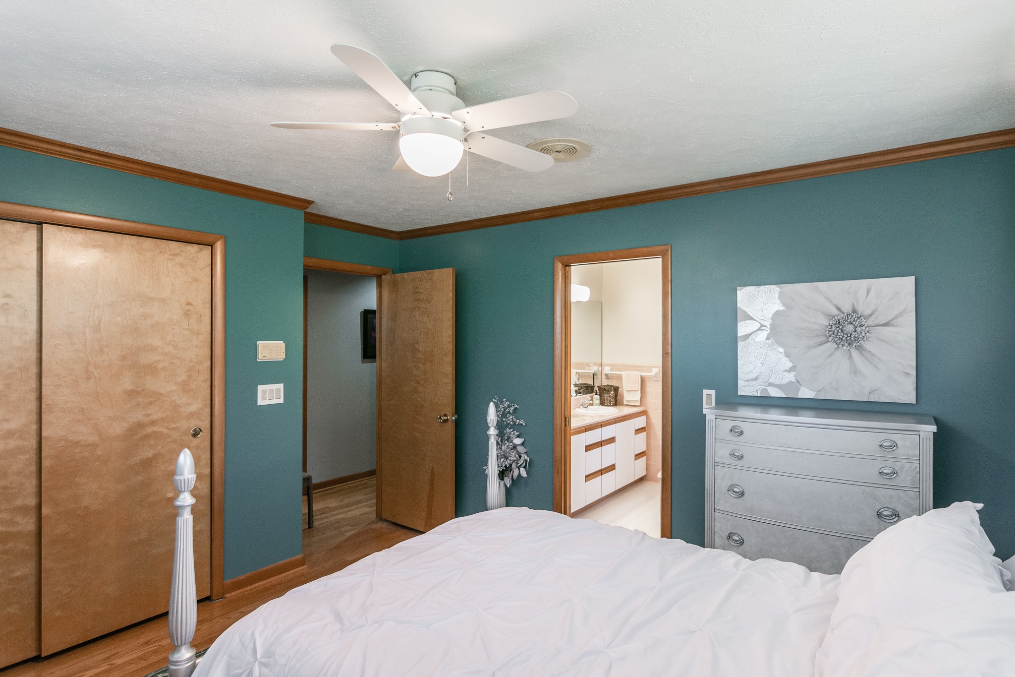 705 Ronnie Road Madison, TN 37115 - Photo 29 of 50 a bedroom with a large bed and a chandelier