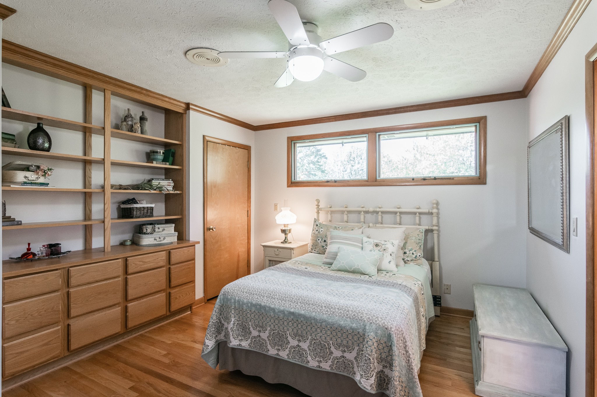 705 Ronnie Road Madison, TN 37115 - Photo 32 of 50 a bedroom with a bed cabinets and window