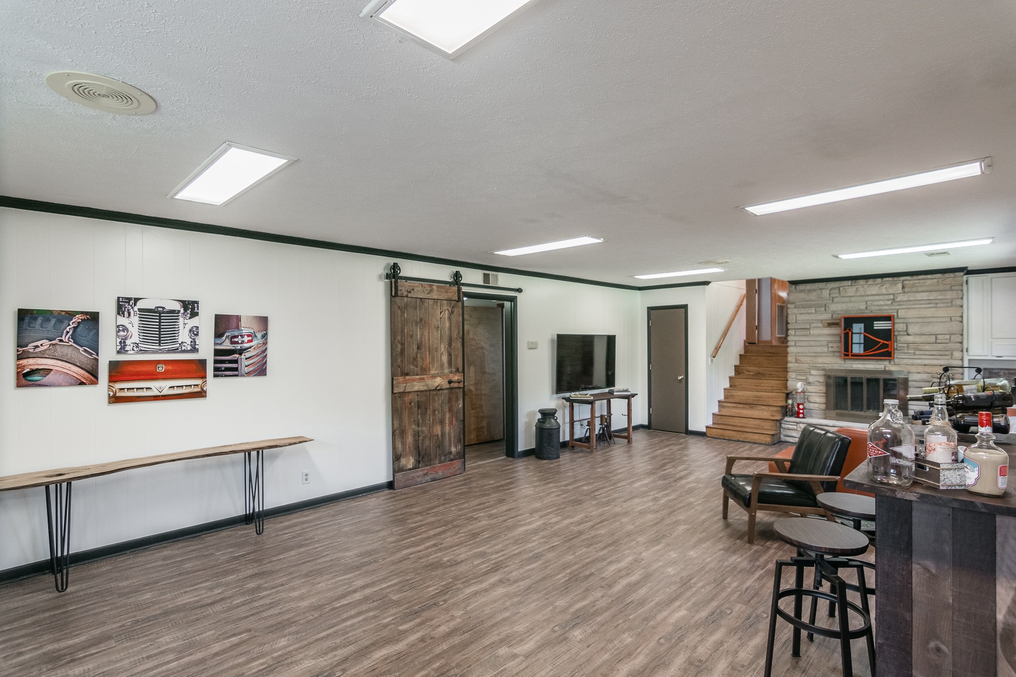 705 Ronnie Road Madison, TN 37115 - Photo 34 of 50 a living room with furniture flat screen tv and wooden floor