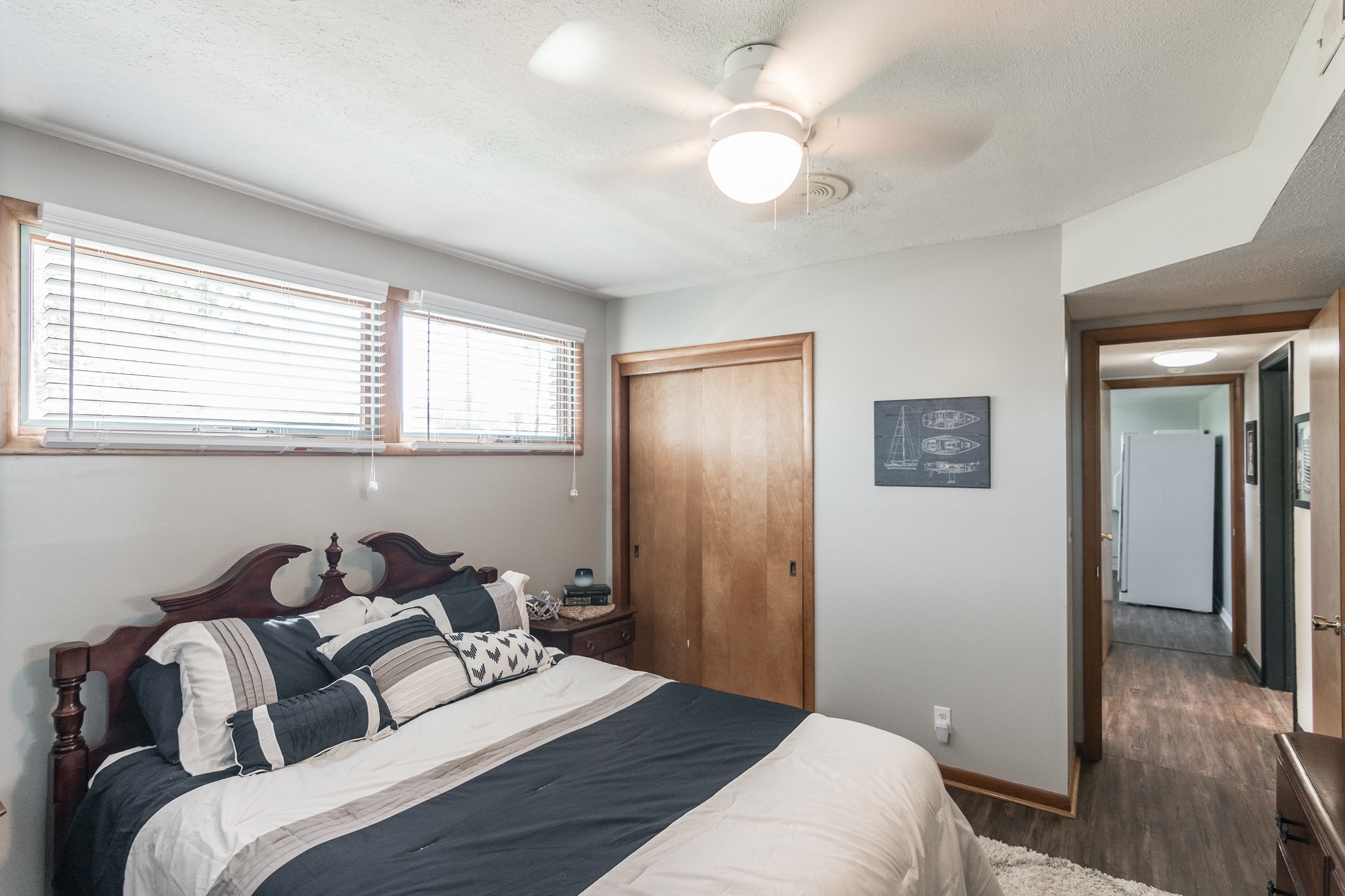 705 Ronnie Road Madison, TN 37115 - Photo 37 of 50 a bedroom with a bed and a chandelier