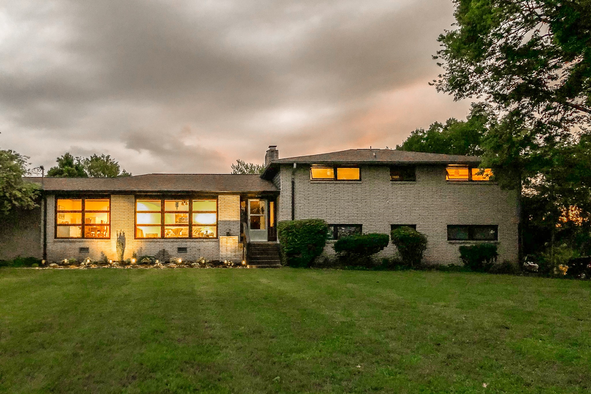 705 Ronnie Road Madison, TN 37115 - Photo 7 of 50 a front view of a house with a garden and yard