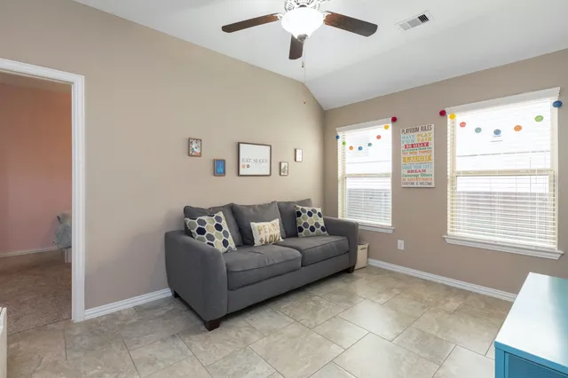 a living room with furniture and a window