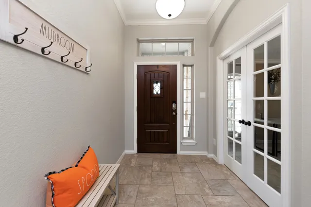 a view of a hallway with seating area