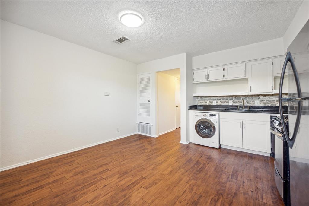 2401 Manor Road, Unit 232A Austin, TX 78722 - Photo 2 of 6 a view of a storage & utility room with washer and dryer