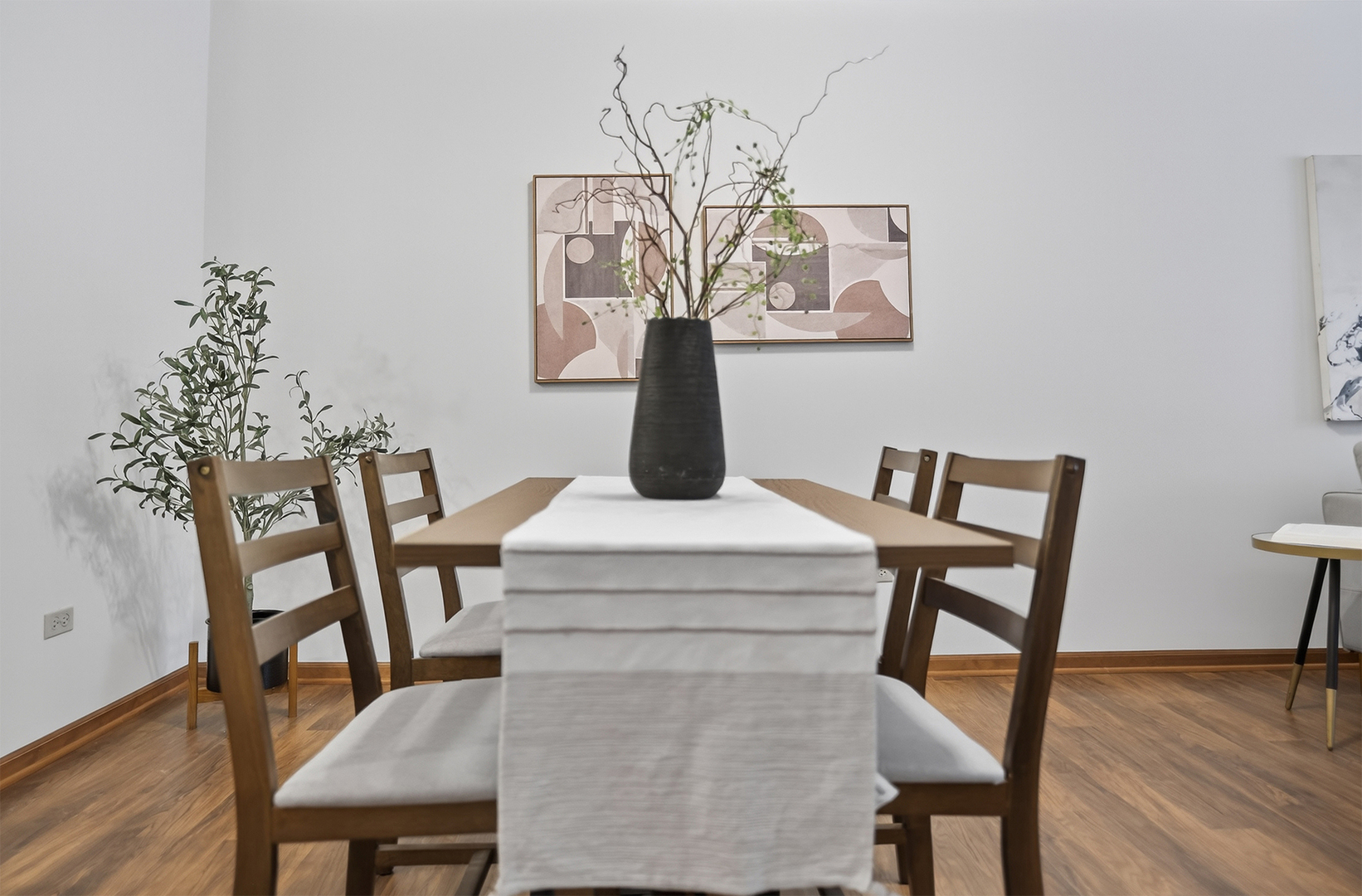 10 Ford Street, Unit 103 Geneva, IL 60134 - Photo 13 of 18 a view of a dining room with furniture and wooden floor