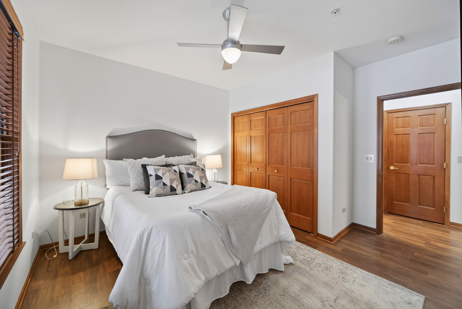 10 Ford Street, Unit 103 Geneva, IL 60134 - Photo 15 of 18 a bedroom with a bed and a table in it