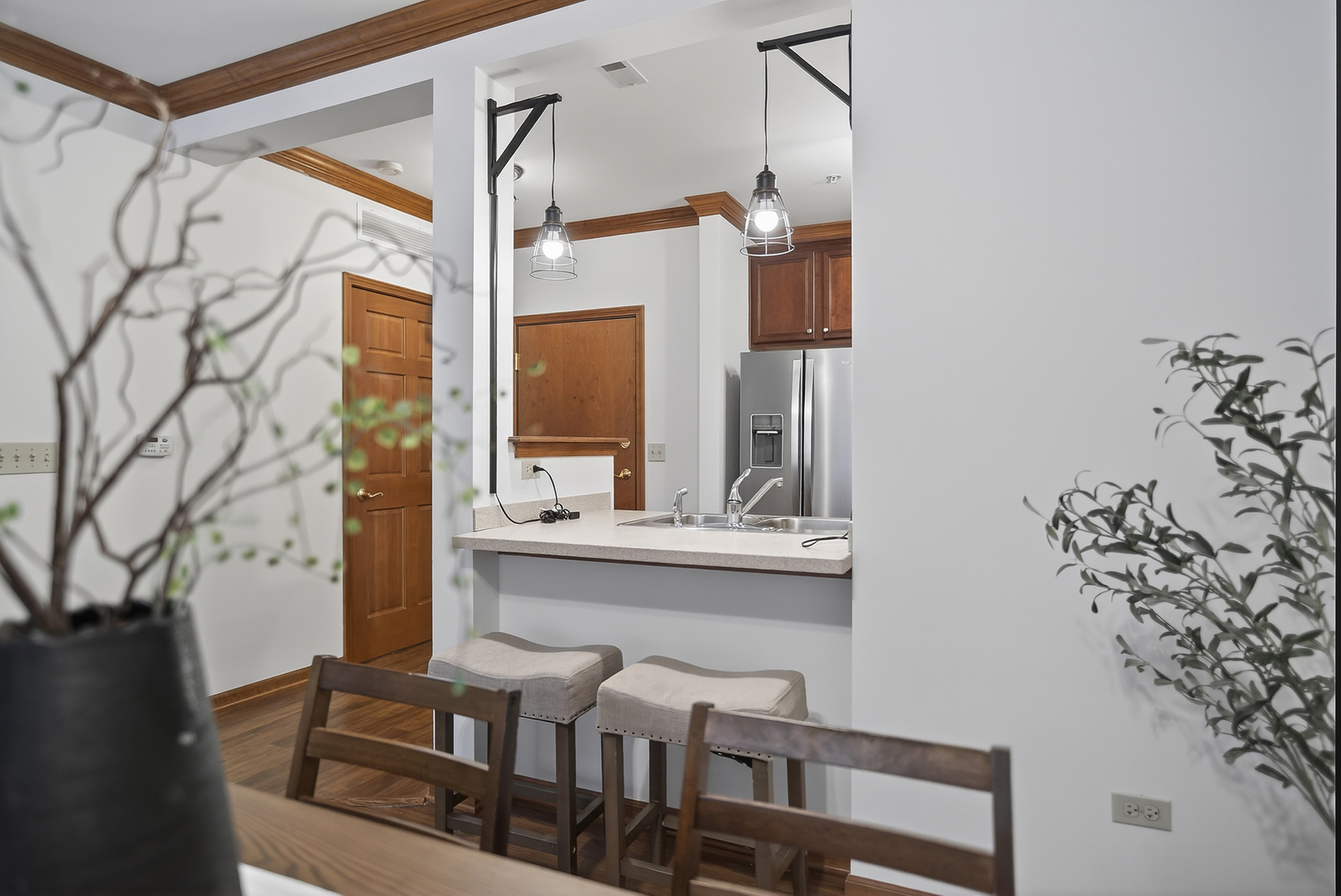 10 Ford Street, Unit 103 Geneva, IL 60134 - Photo 4 of 18 a view of a room with a table and chairs